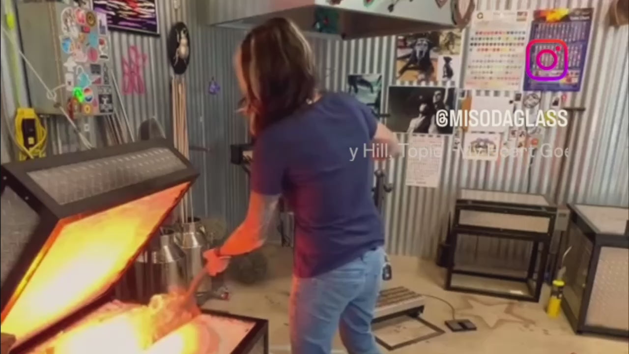 Load video: @Misodaglass Melissa using a glass hive furnace.